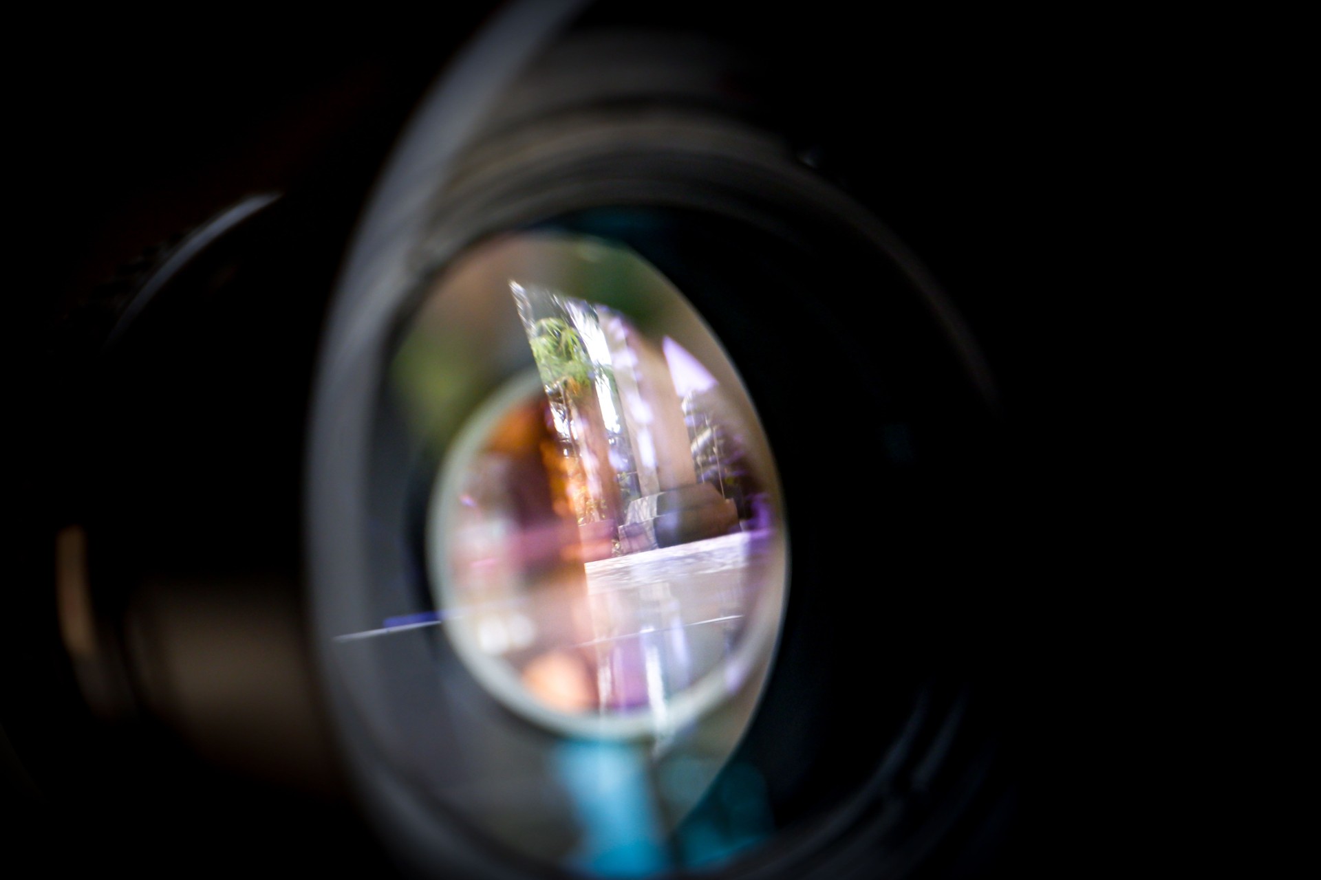 Close up of DSLR, SLR or Mirrorless camera lens and see through the lenses structure inside with also the reflection on lens surface.